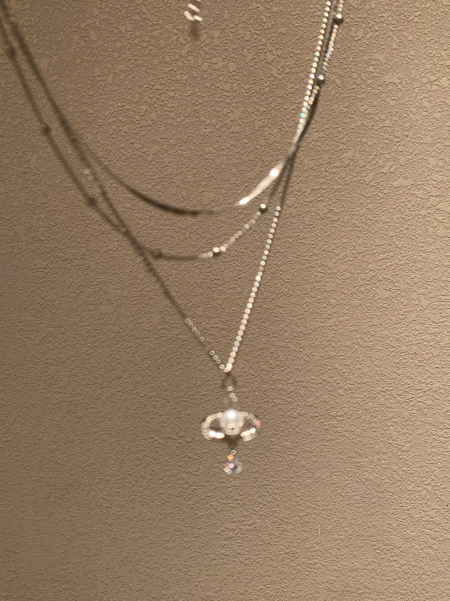 Elegant layered necklace with crystal pendant, minimalist design for everyday wear