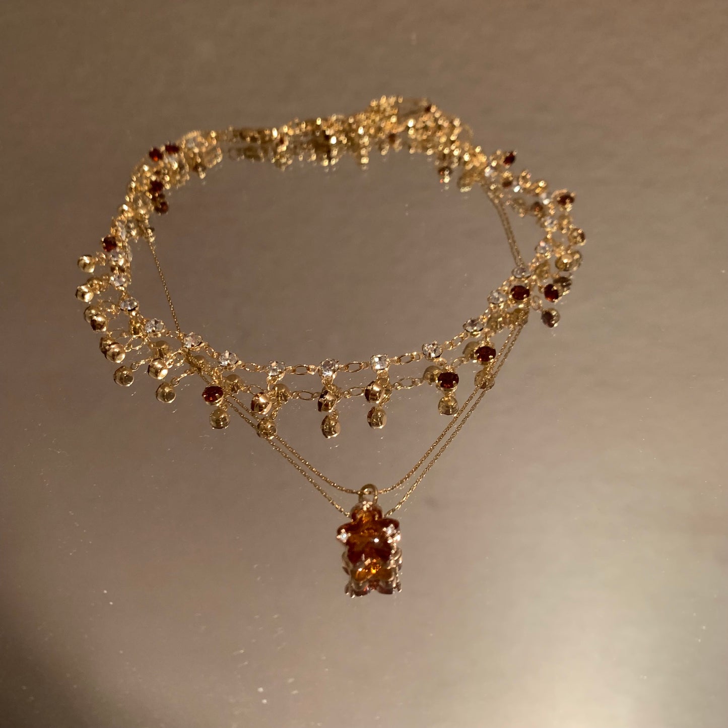 Double-layered necklace with five-pointed star pendant