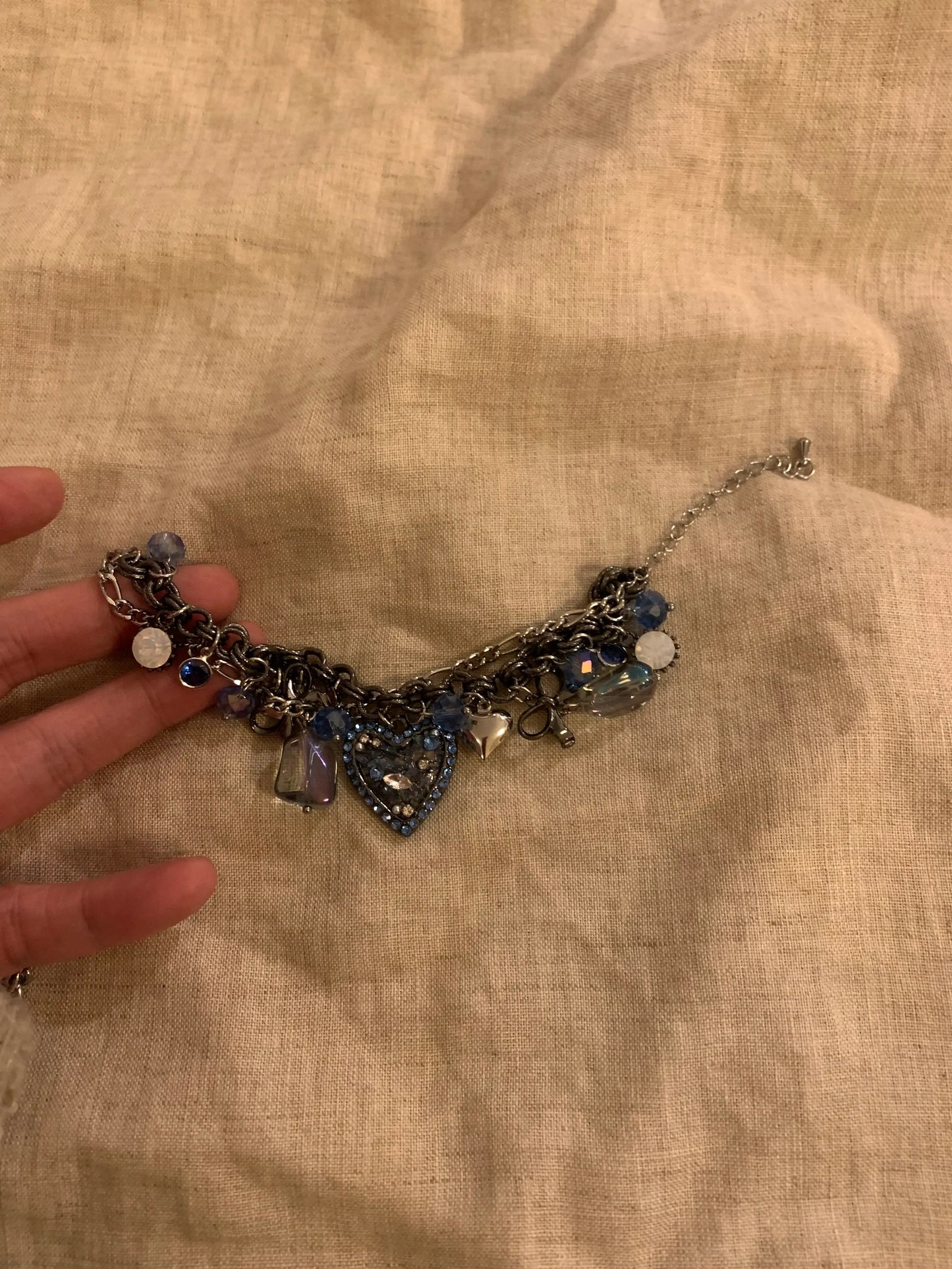 Elegant charm bracelet with blue crystals and heart pendant, handcrafted minimalist jewelry