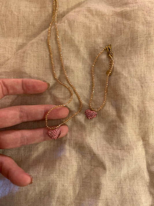 Delicate gold chain necklace with pink heart pendant, minimalist design for everyday wear