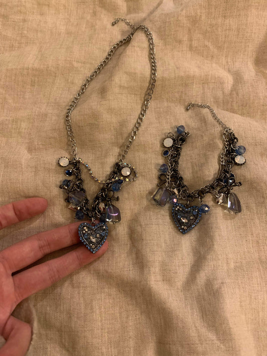Elegant heart charm necklace with blue crystals and silver chain, perfect for gifting