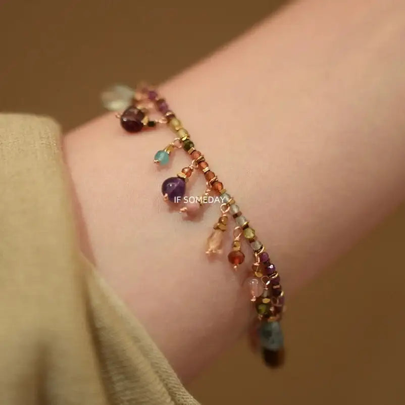 Delicate multi-gemstone bracelet with dangling charms, minimalist boho style, ethical jewelry